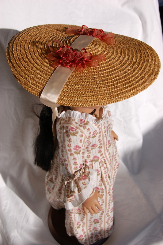 American Girl Doll Felicity wears a large straw bergere doll hat
