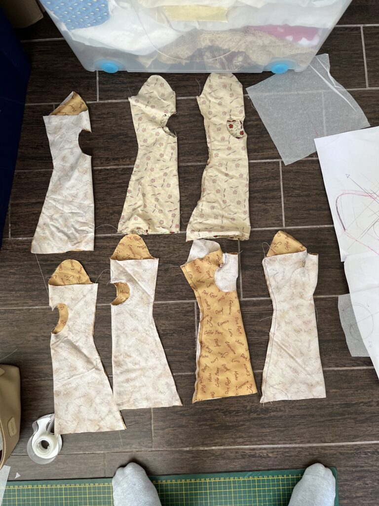 Seven pairs of mitt mockups lie on the floor