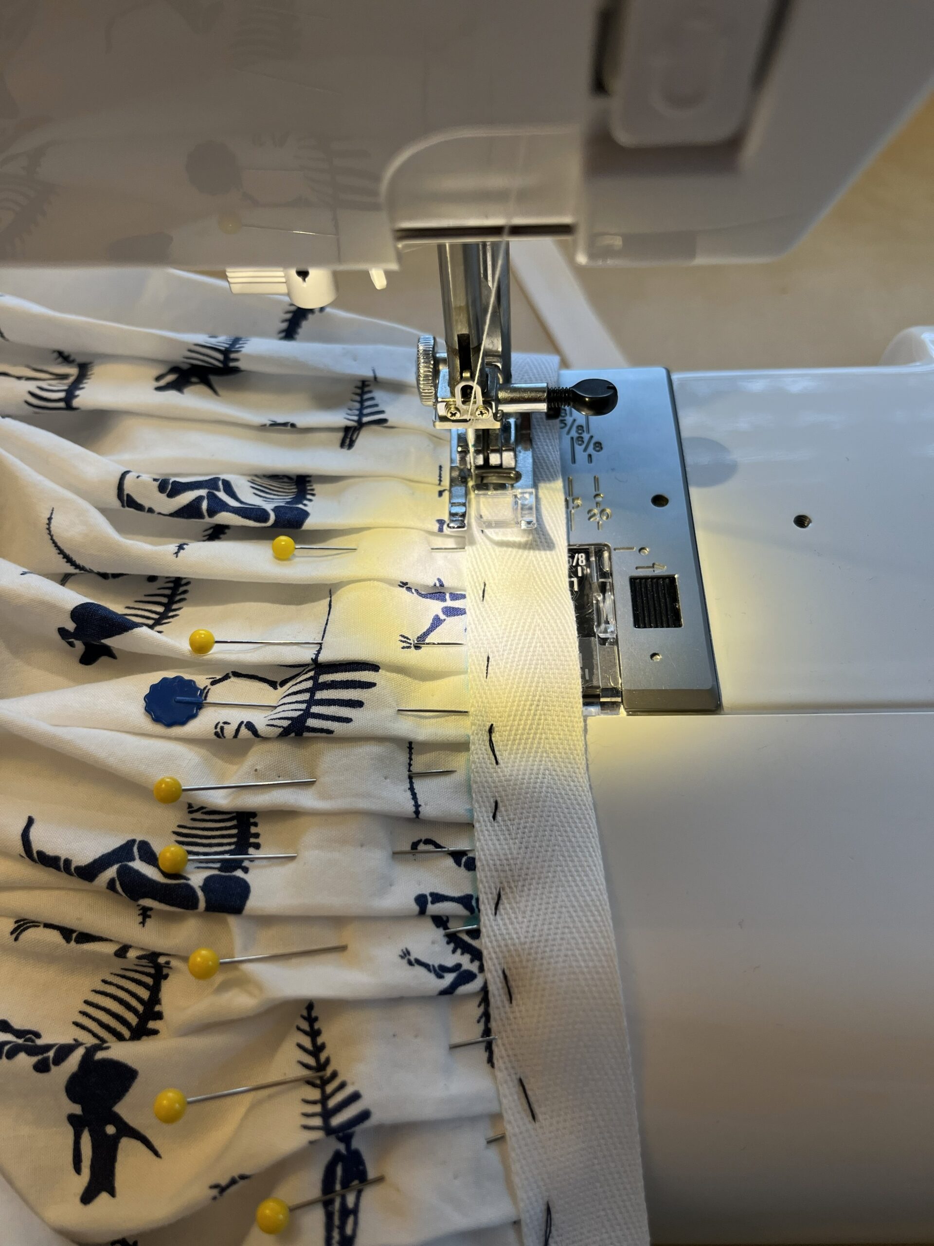 waist tape being machine sewn to an 18th century petticoat