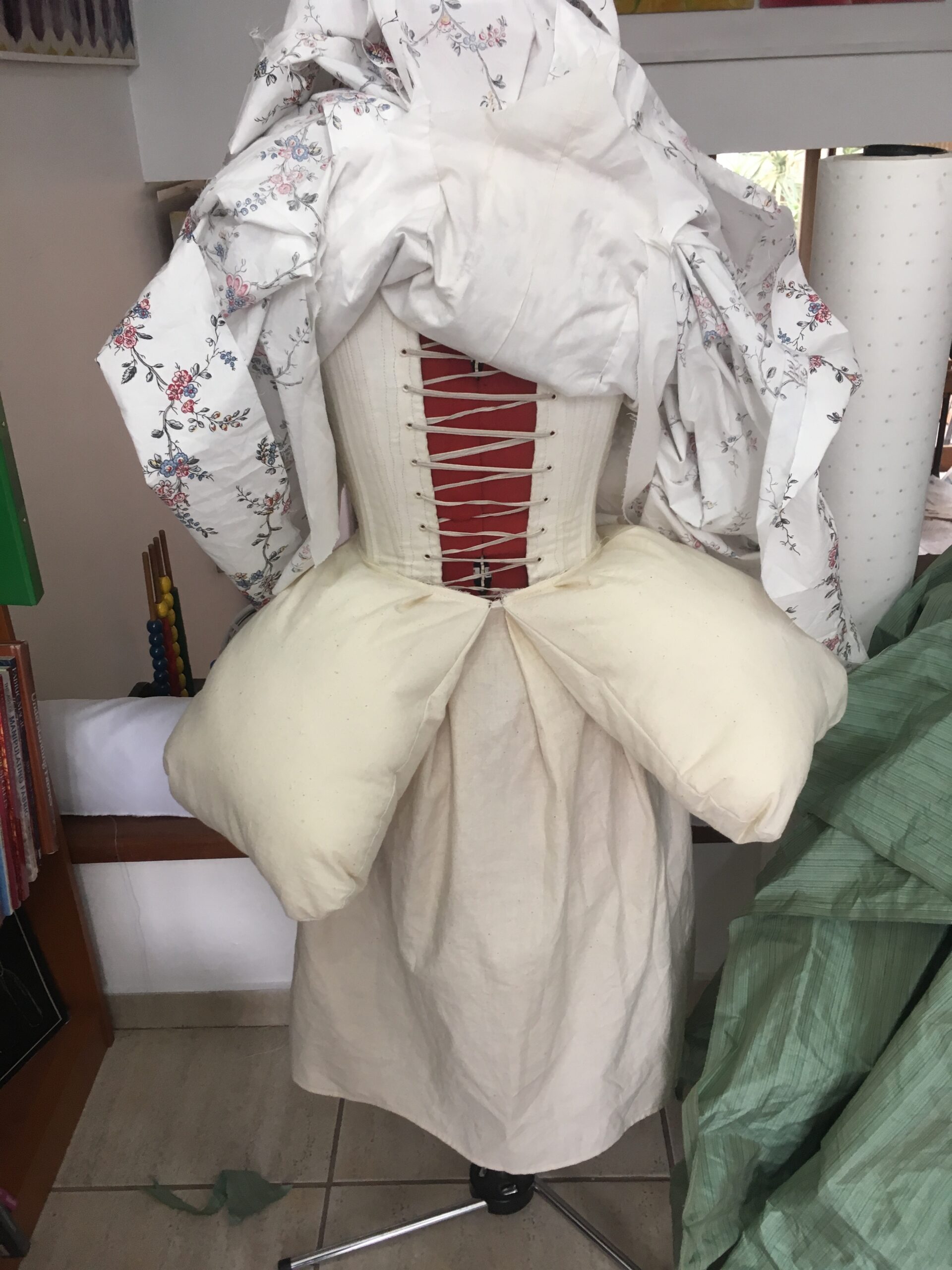 A mannequin is dressed in 1780s stays and a split rump