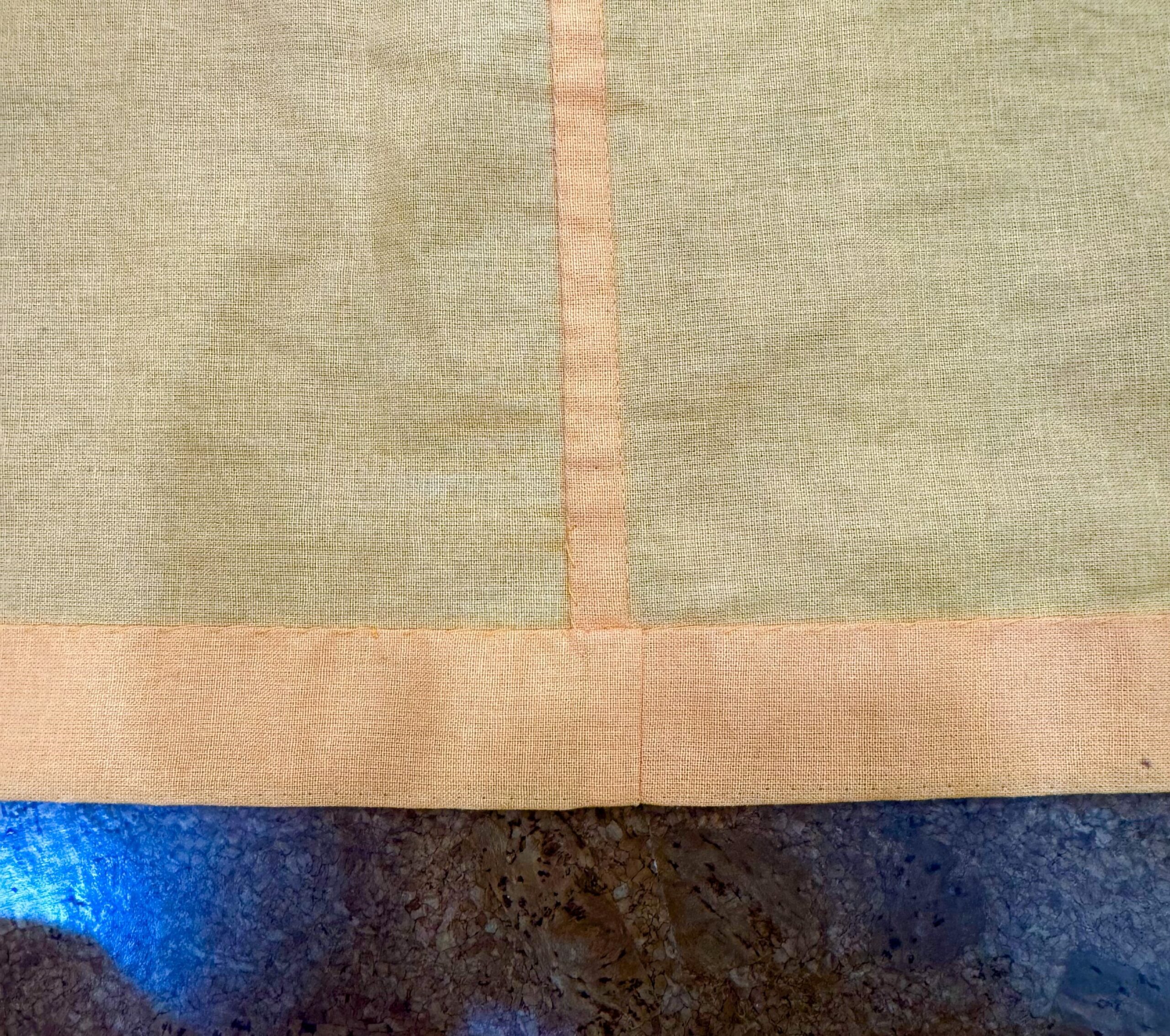 A hem on an orange petticoat