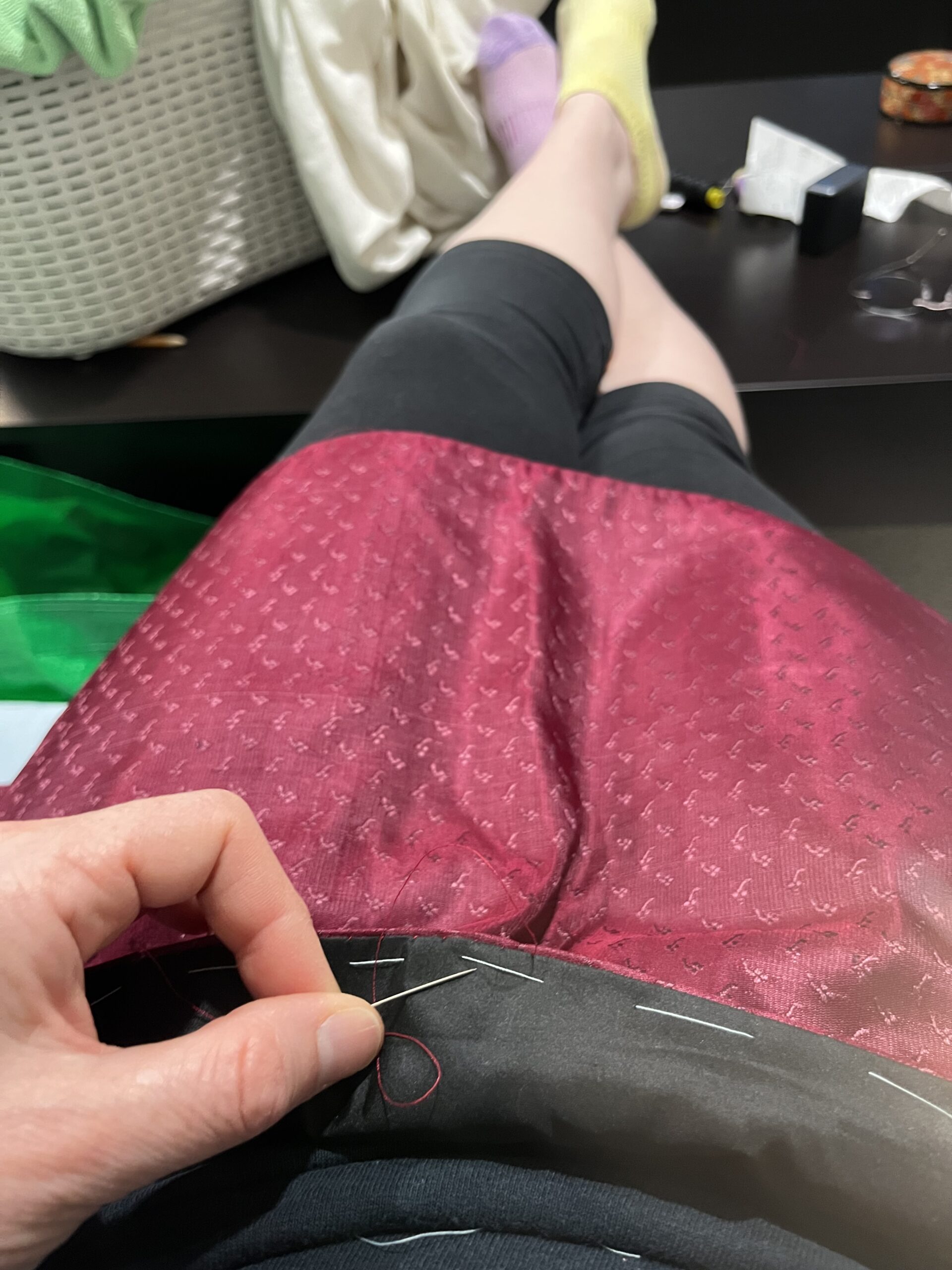 Whipping black wool to figured burgundy silk