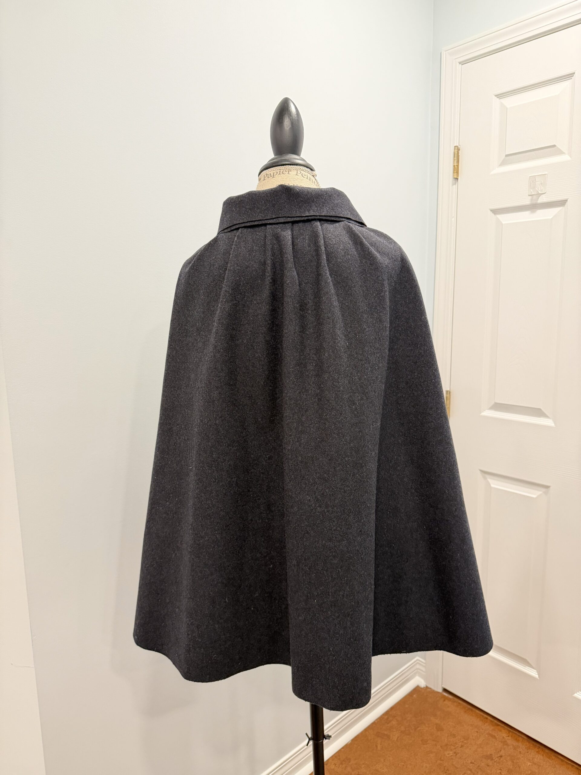back view of grey 18th century wool short cloak