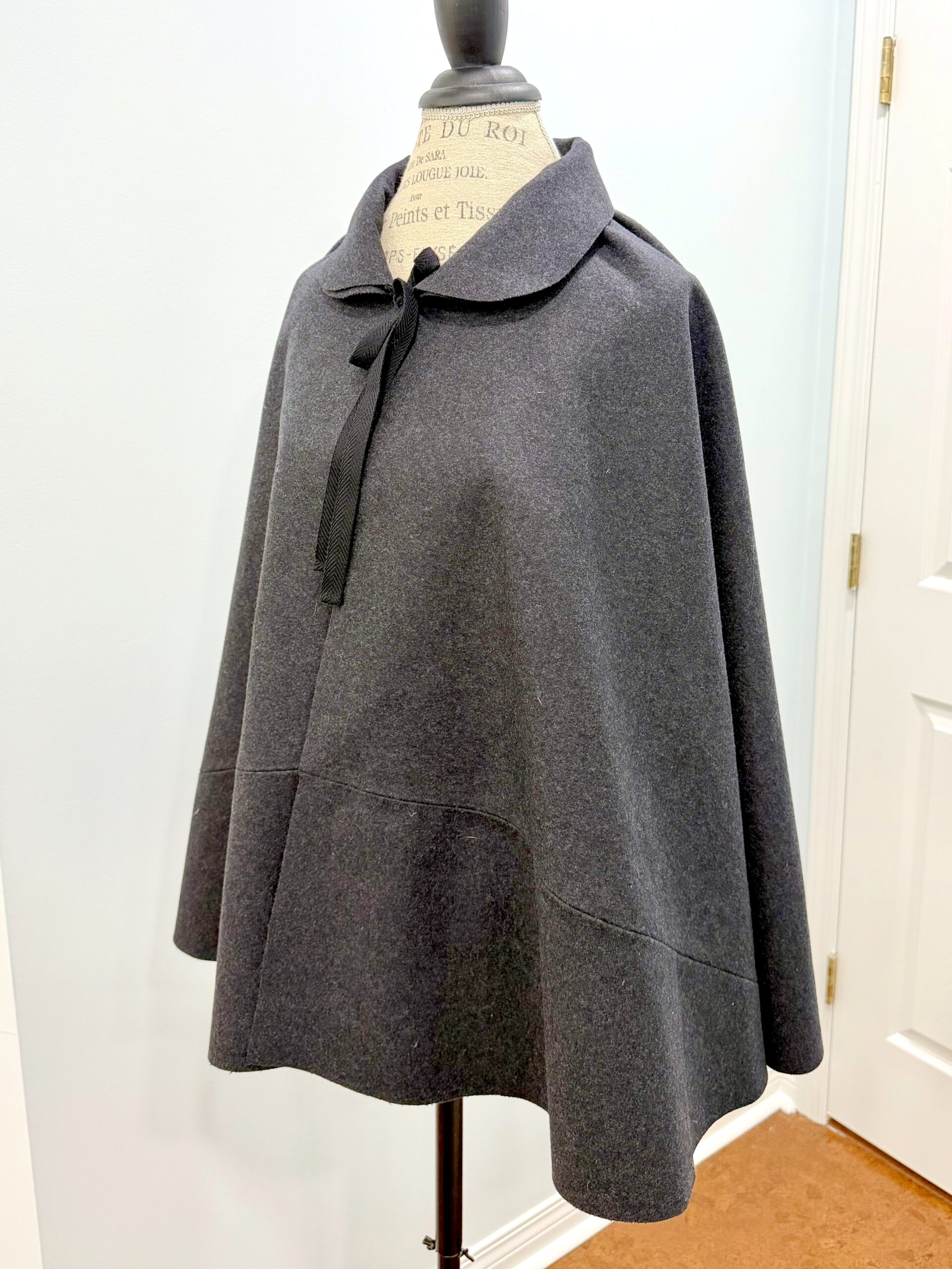 3/4 view of the Burnley and Trowbridge 18th Century Short Cloak in charcoal wool