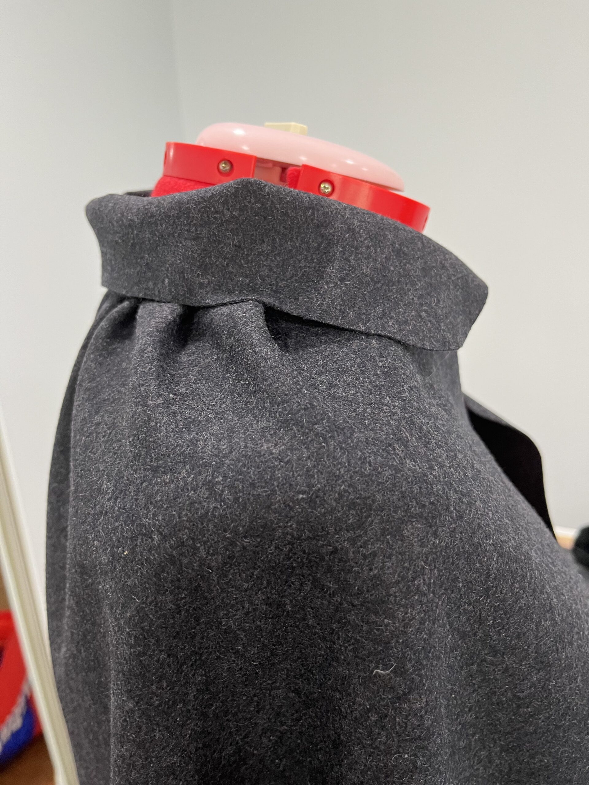 close up of the shoulders of an 18th century short cloak