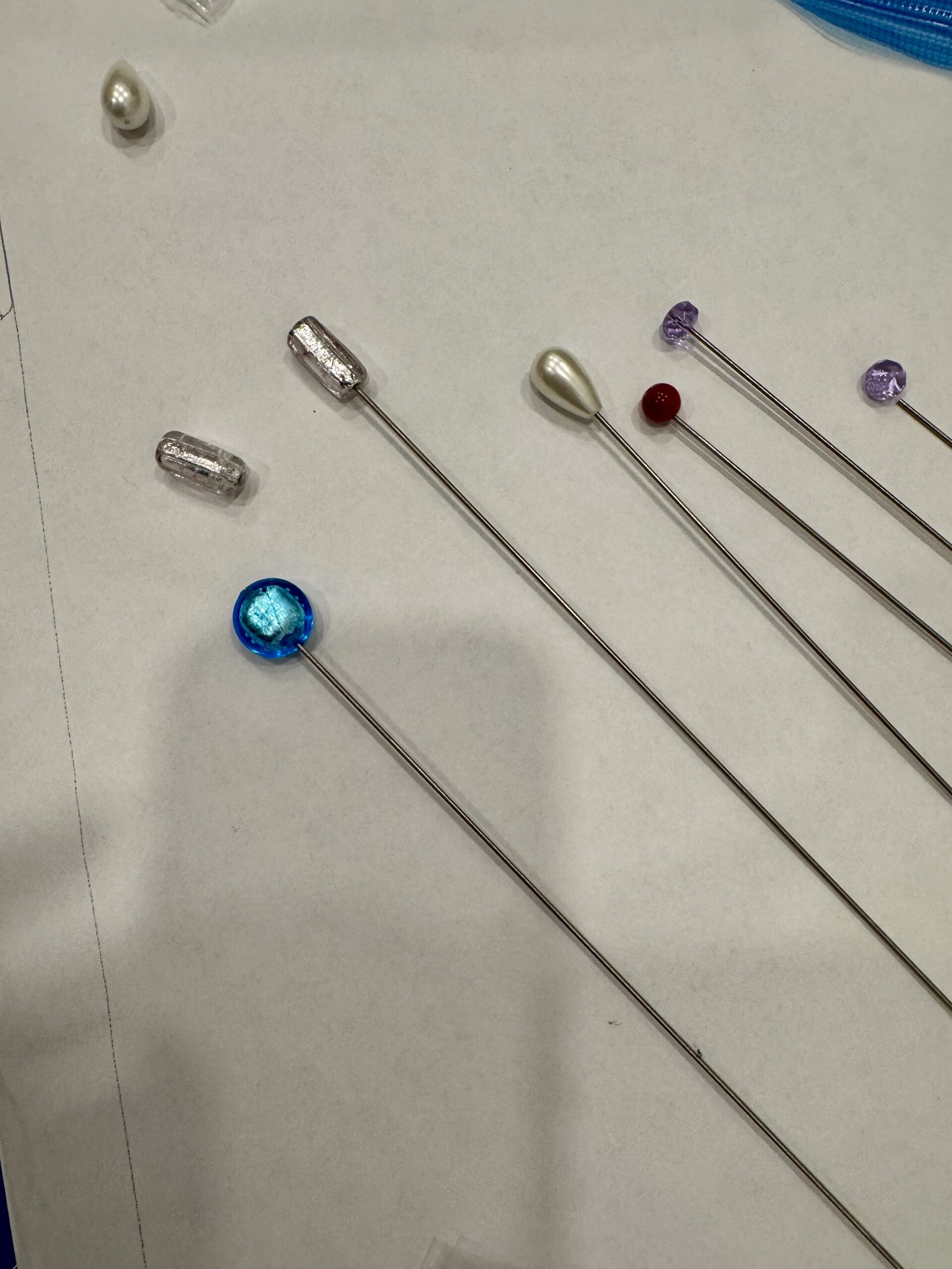 hat pin shanks with a selection of glass beads