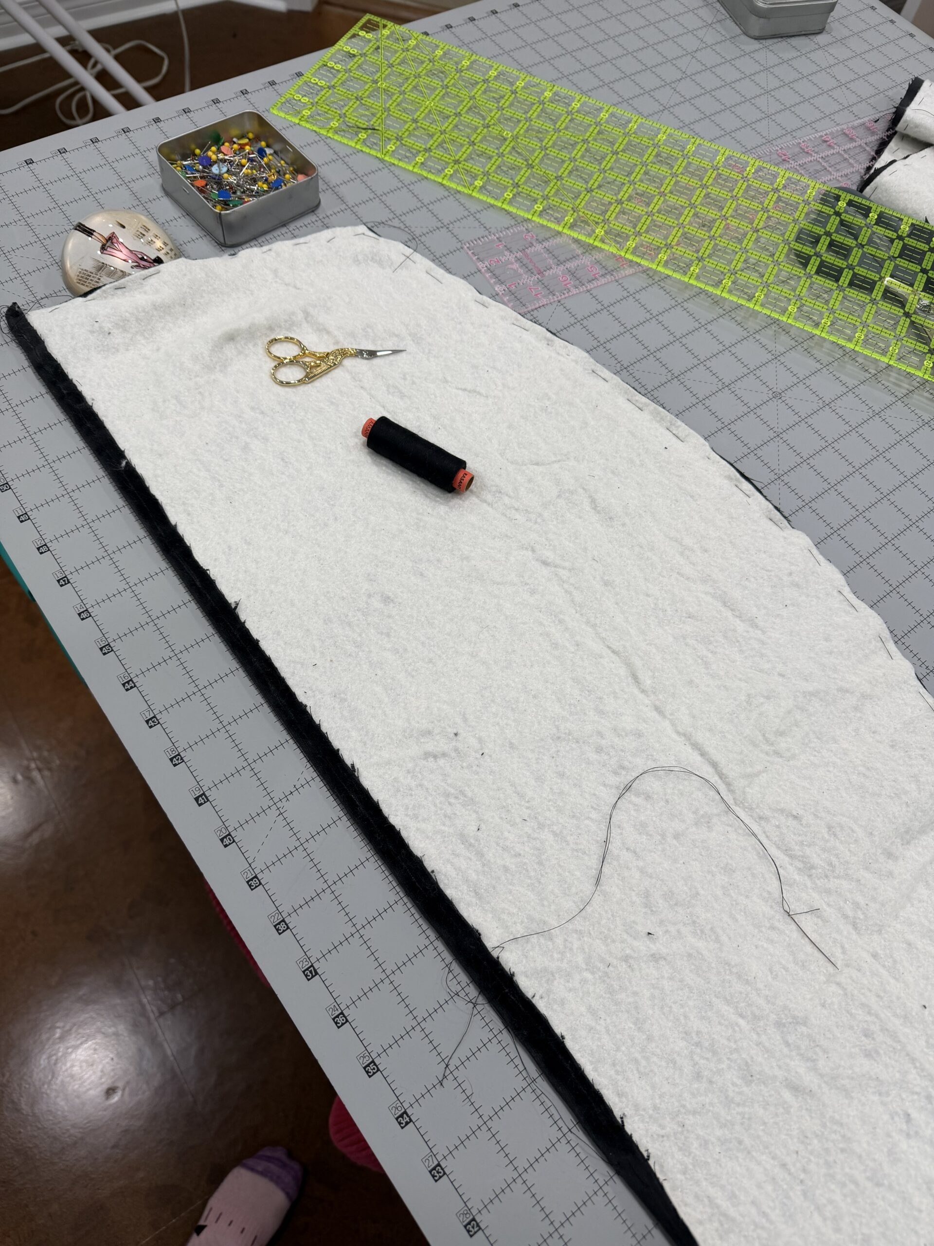 a length of ice wool interlining lying on a piece of velvet