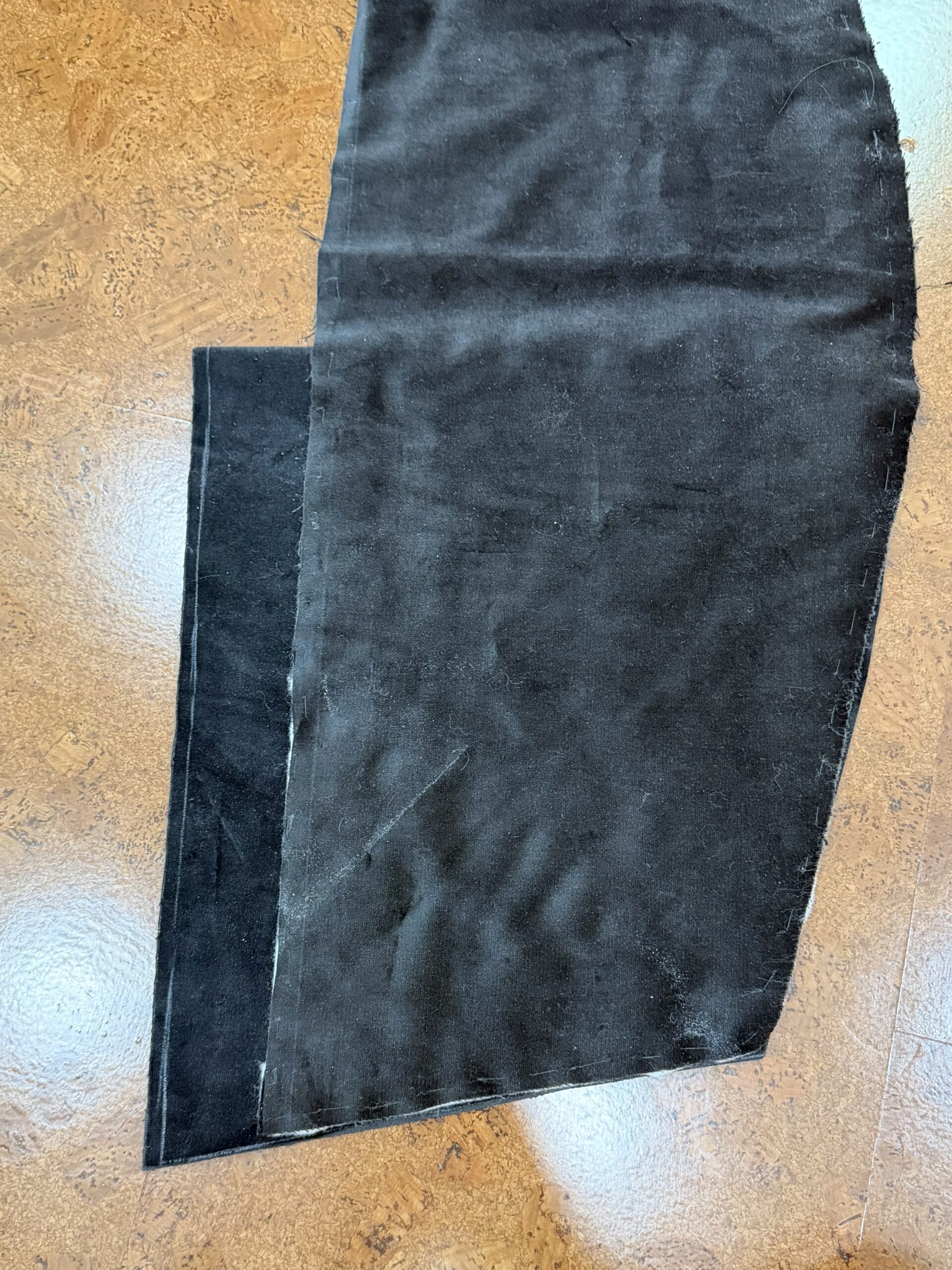 two hood bodies laid against each other - one is two inches longer