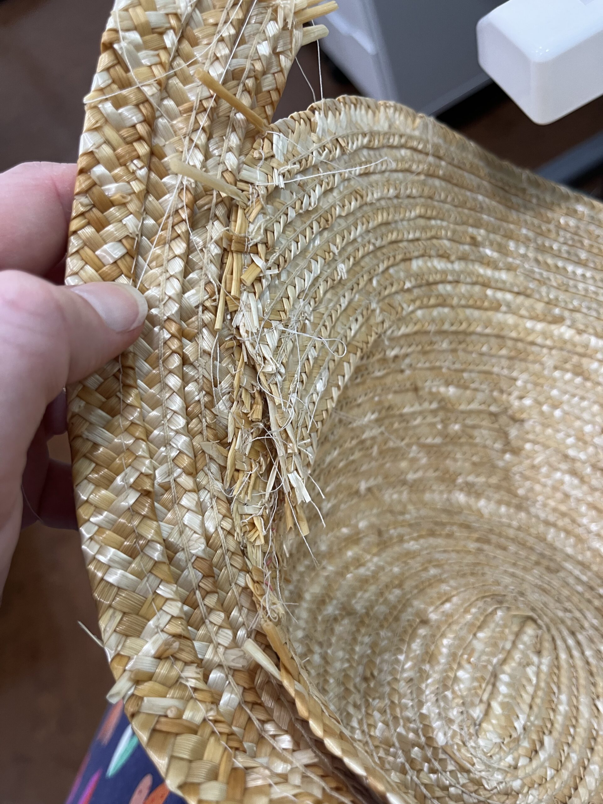 a mess of raw splintery straw ends inside an experimental straw millinery project