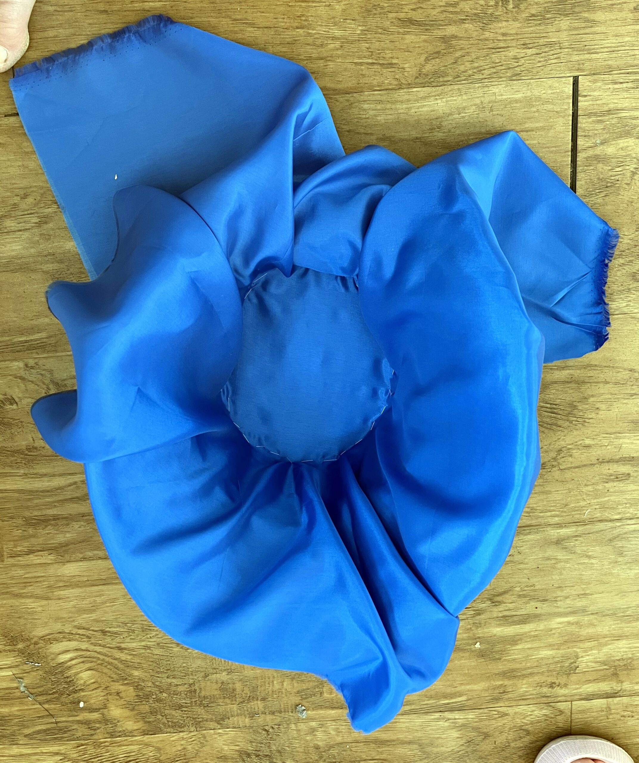 blue bemsilk fabric draped over a bonnet