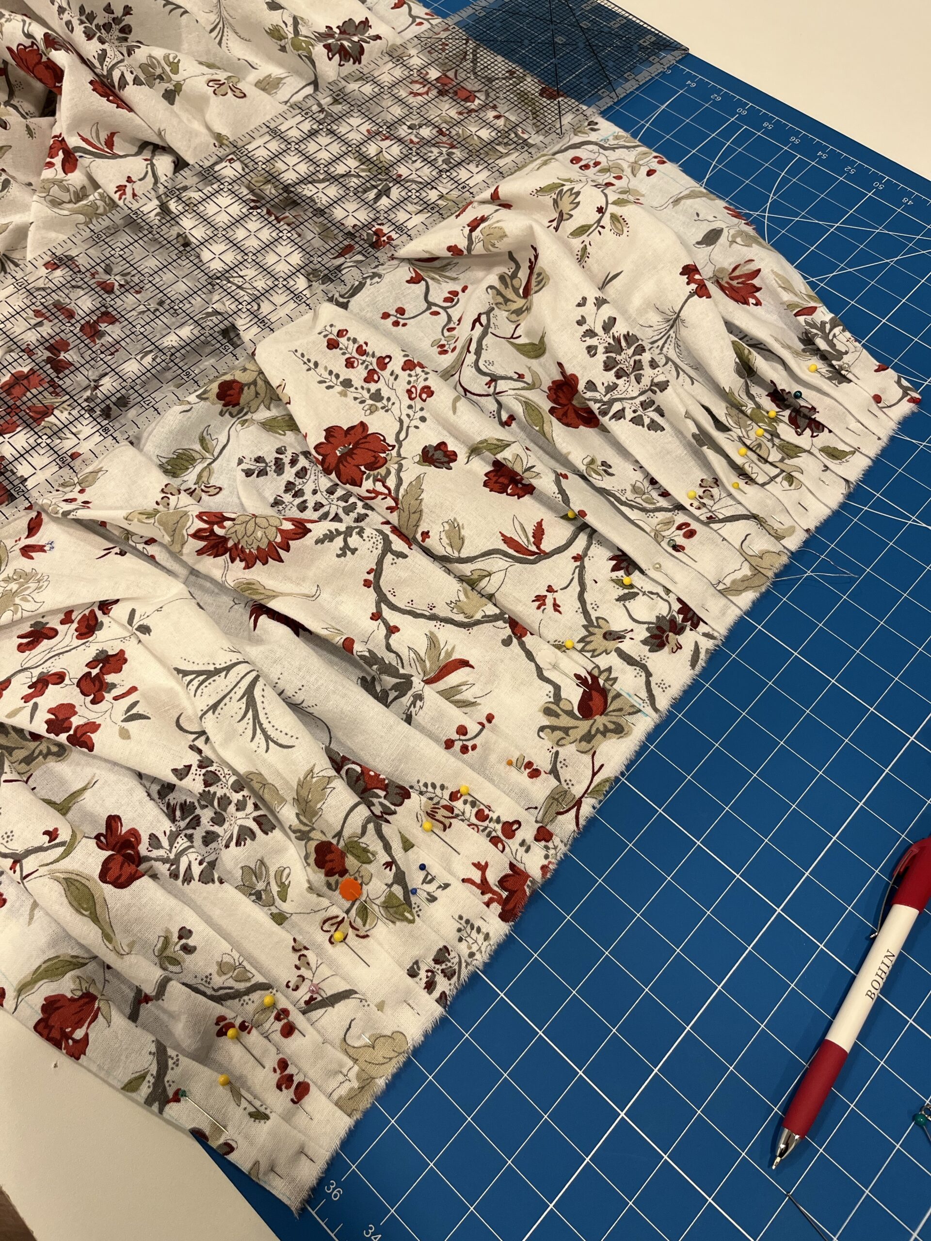 A cream ikea chintz fabric being pleated for a petticoat
